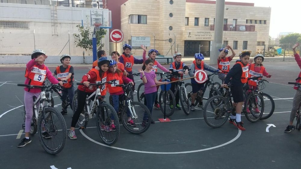 Matzok kids bike safety training at a school courtyard